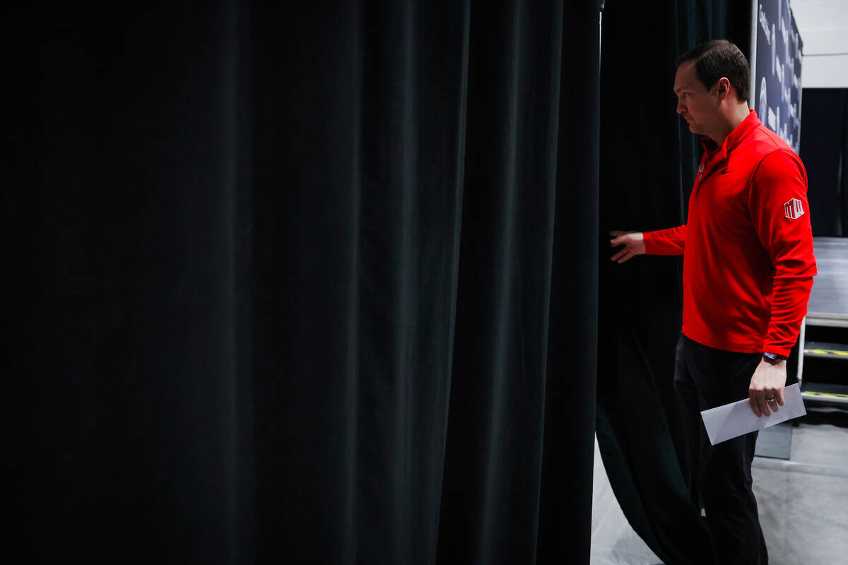 UNLV head coach Kevin Kruger walks out of a press conference after losing a Mountain West tourn ...