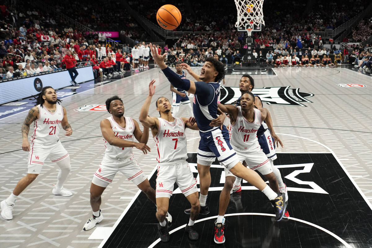 Arizona forward Trey Townsend (4) puts up a shot during the first half of an NCAA college baske ...