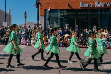 Members of Legacy Dance walk down Water Street during the annual St. Patrick’s Day parad ...
