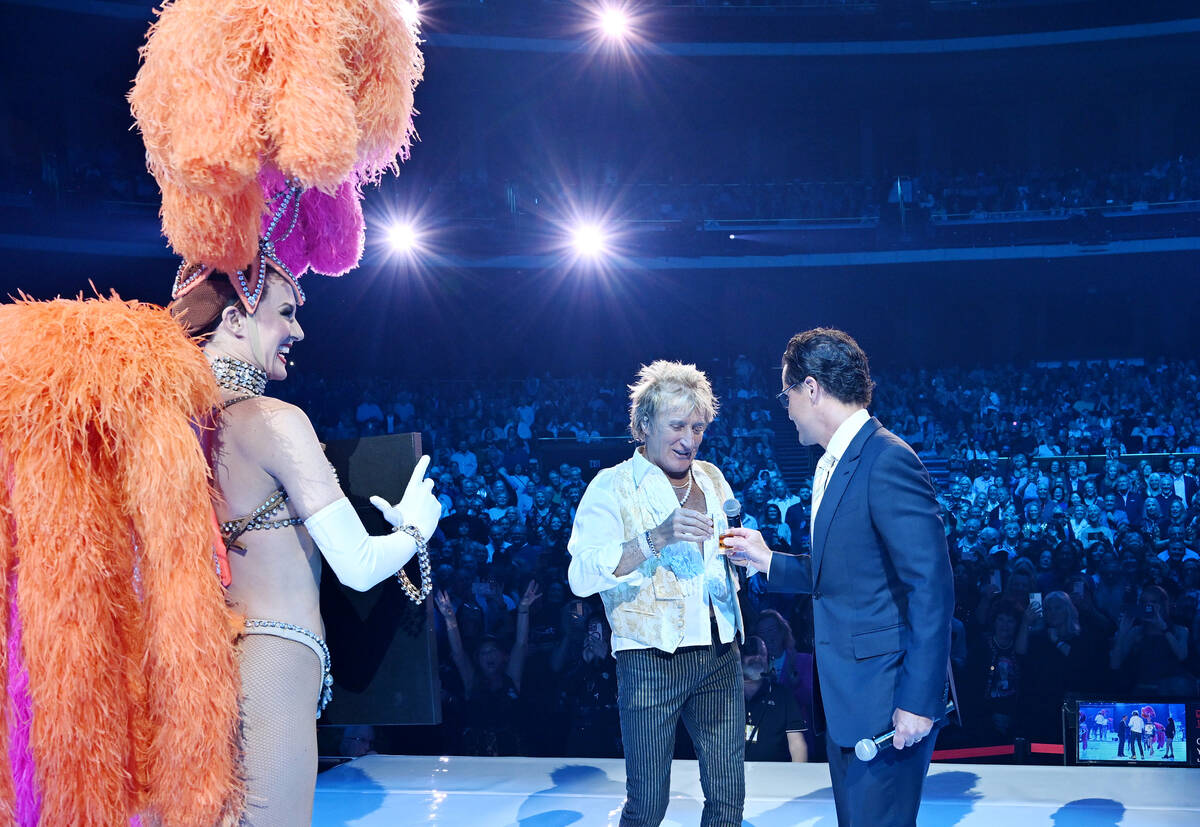 Rod Stewart toast an unidentified shot with Sean McBurney, regional president of Caesars Entert ...