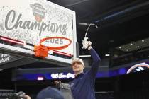 UC San Diego head coach Eric Olen participates in a net-cutting ceremony after an NCAA college ...