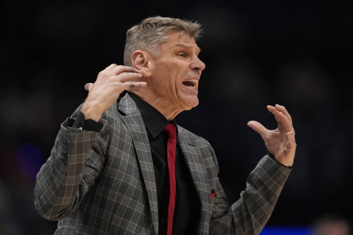 Oklahoma head coach Porter Moser walks on the court during the second half of an NCAA college b ...