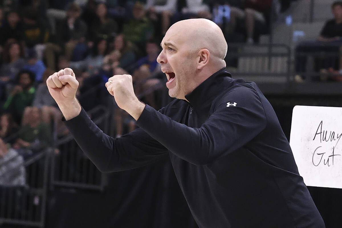 FILE - Utah head coach Craig Smith calls a play to his team during the first half of an NCAA co ...