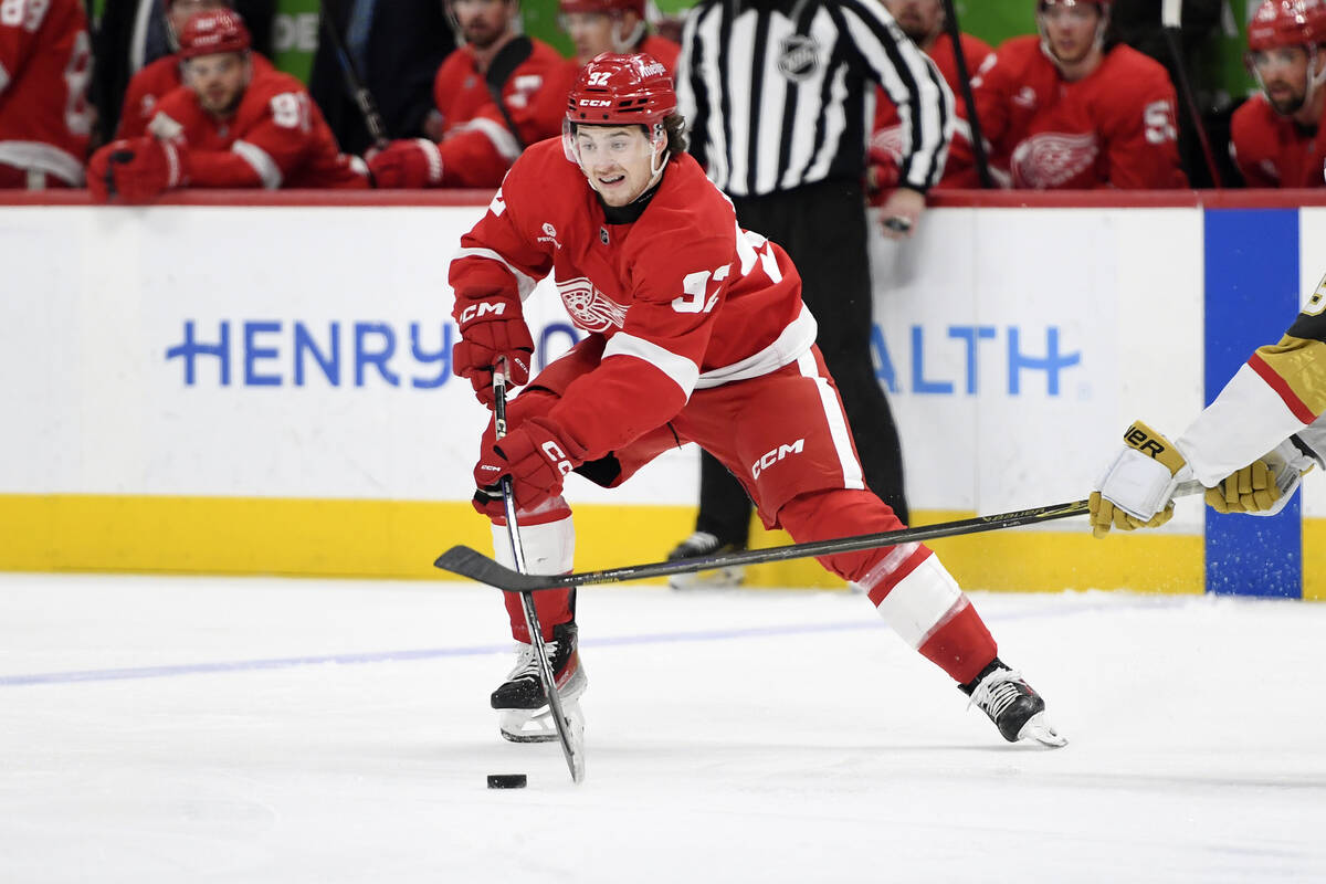 Detroit Red Wings center Marco Kasper skates with the puck during the first period of an NHL ho ...
