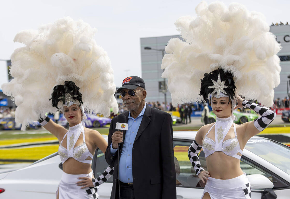 Actor Morgan Freeman, center, serves as the Grand Marshal for the pre-race ceremonies at the Pe ...