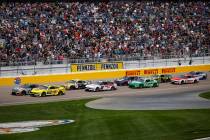 Drivers round the track as they prepare for the start of the Pennzoil 400 NASCAR Cup Series rac ...