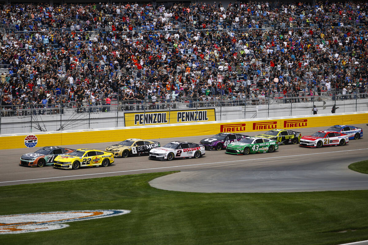 Drivers round the track as they prepare for the start of the Pennzoil 400 NASCAR Cup Series rac ...