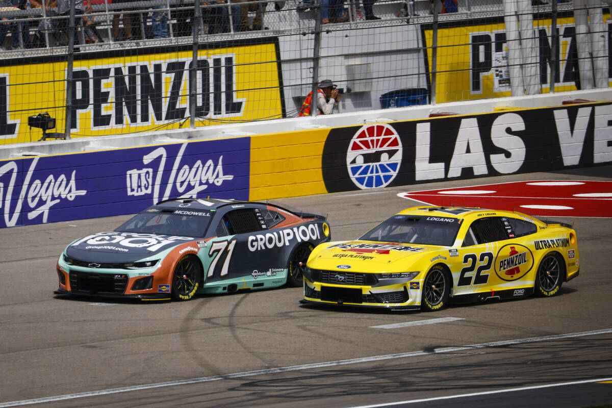 Drivers Michael McDowell (71) and Joey Logano (22) fight for position during the Pennzoil 400 N ...
