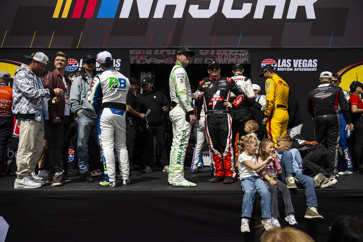 Members of the Backstreet Boys chat with driver John Hunter Nemechek, left, as drivers wait dur ...