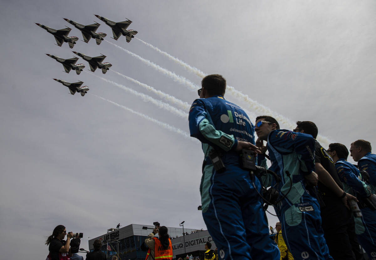 Air Force Thunderbirds fly overhead before the start of the Pennzoil 400 NASCAR Cup Series race ...