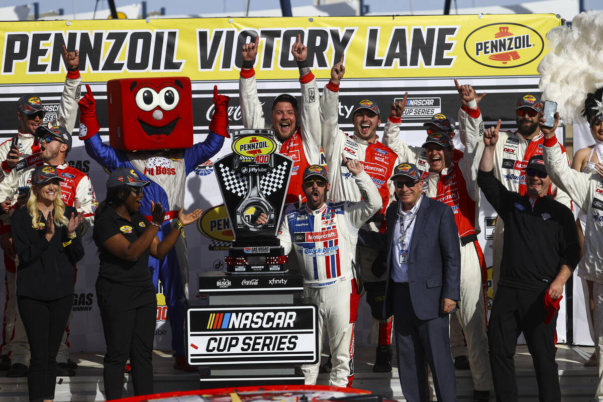 Driver Josh Berry stands with the trophy after winning the Pennzoil 400 NASCAR Cup Series race ...