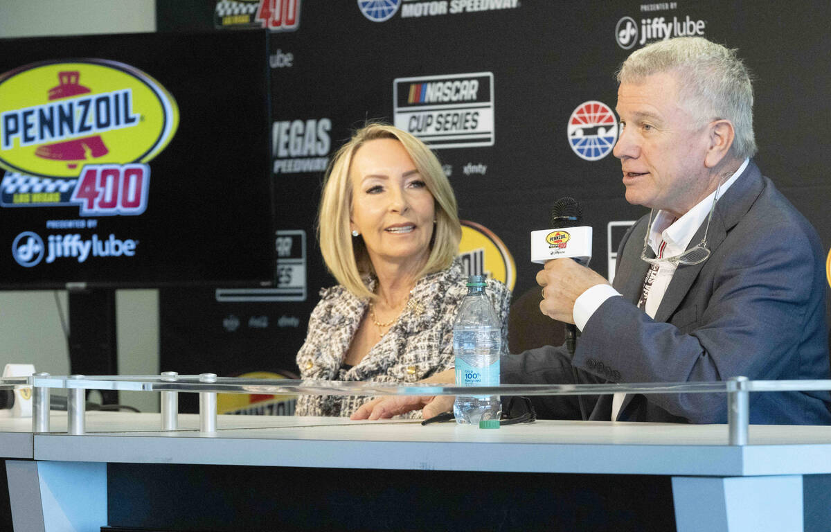 President and general manager of Las Vegas Motor Speedway, Chris Powell, right, with his wife, ...