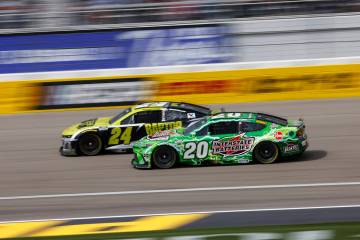 Drivers William Byron (24) and Christopher Bell (20) compete for position during the Pennzoil 4 ...
