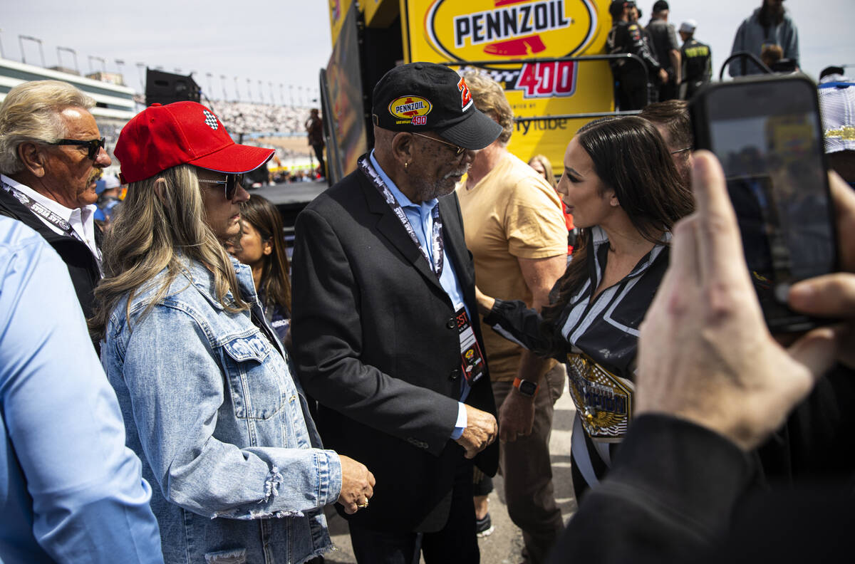 Morgan Freeman, the grand marshal for the race, talks with WWE Champion and honorary pace car d ...