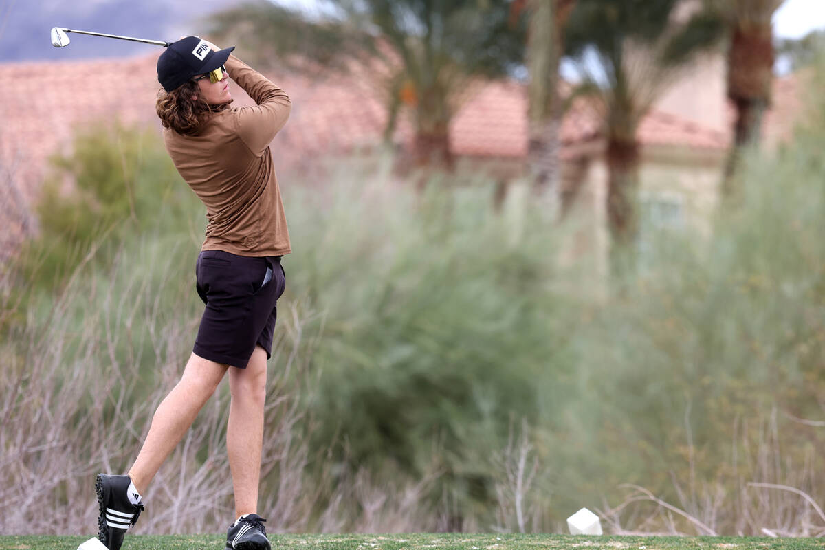 Sky Pointe's Drake Harvey watches his tee shot on the sixth hole during the NIAA Class 4A boys ...