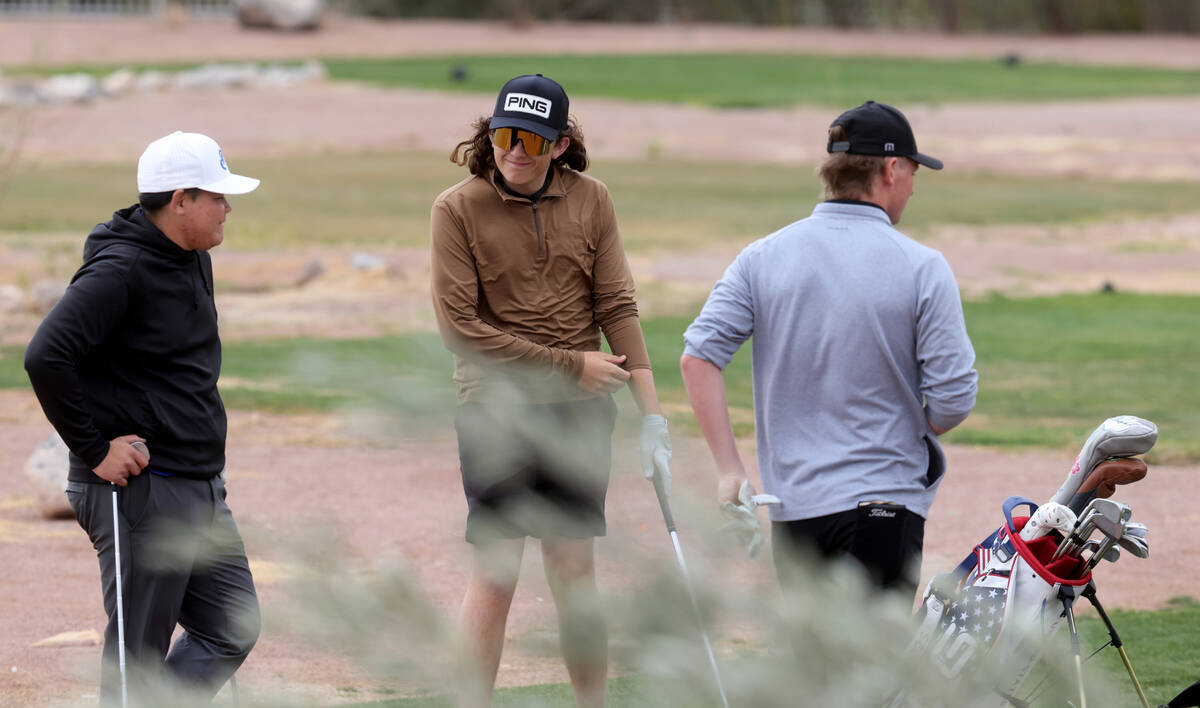 Sky Pointe's Drake Harvey, center, mingles with Sierra Vista’s Forrest Davis, left, and ...