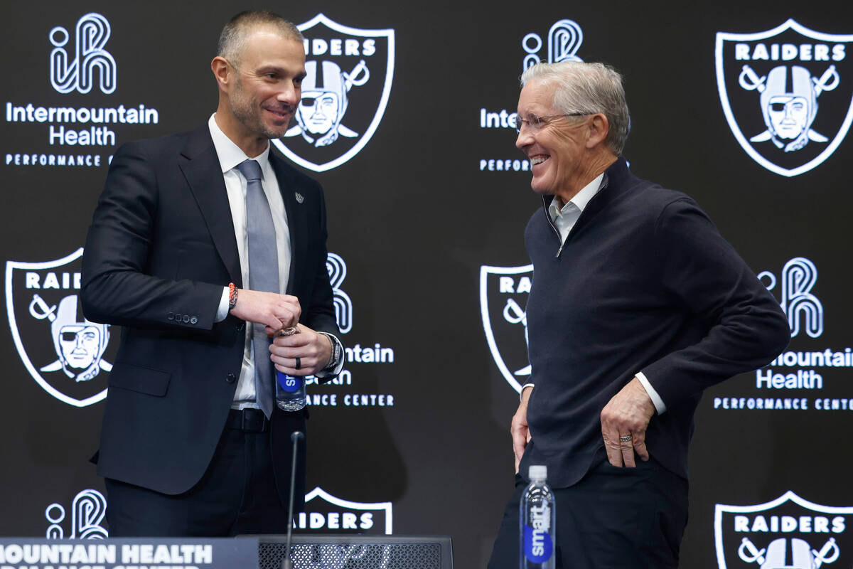 The new Raiders general manager John Spytek, left, and new head coach Pete Carroll share laught ...