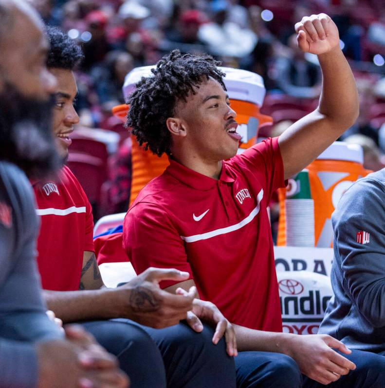 UNLV guard Dedan Thomas Jr. (11) cheers for his teammates from the bench against the Colorado S ...