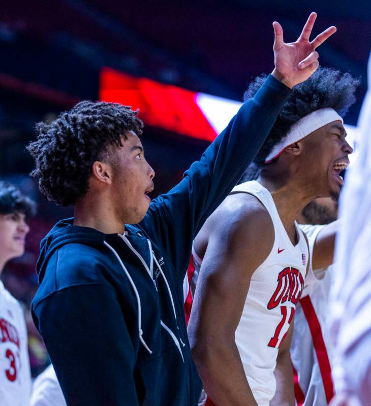 UNLV guard Dedan Thomas Jr. (11) celebrates a three-point basket against the San Diego State Az ...