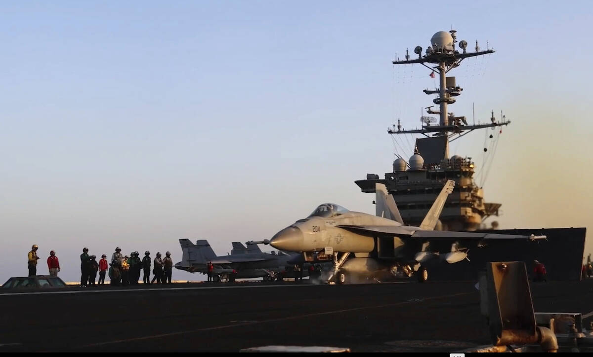 This image taken from video provided by the U.S. Navy shows an aircraft launching from the USS ...