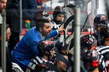 UNLV head coach Anthony Vignieri-Greener cousels his players on the bench as the club hockey te ...