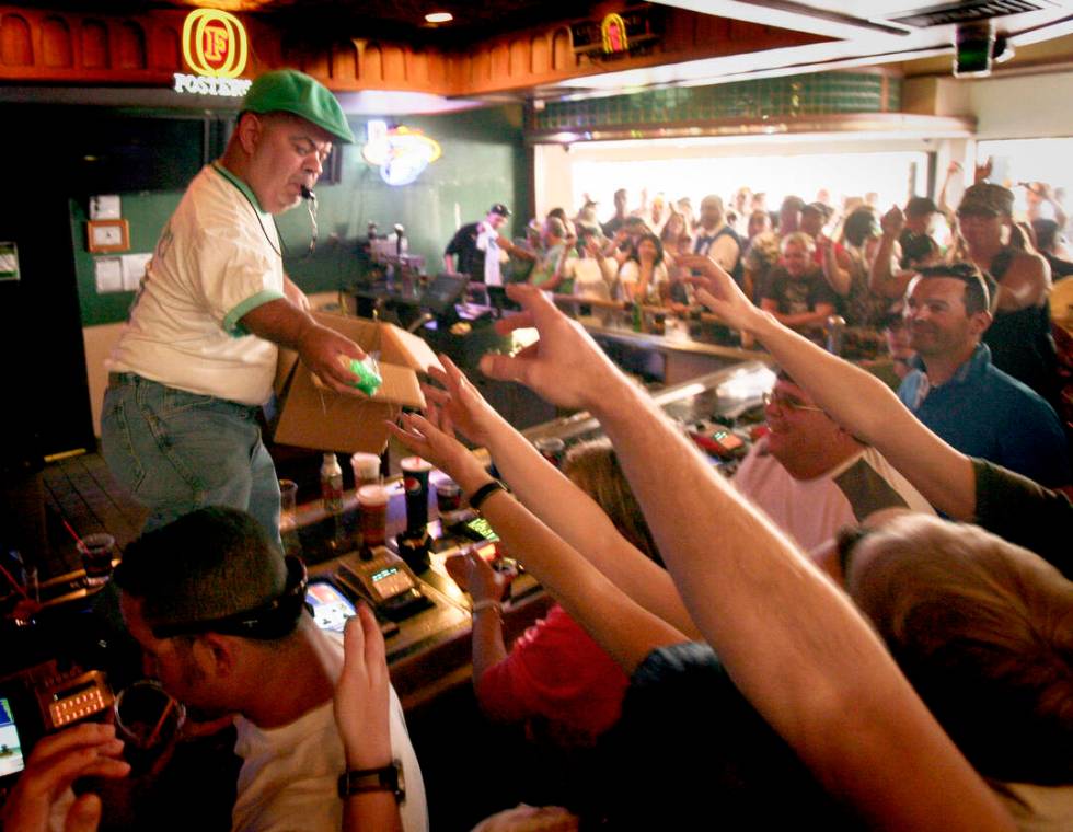 Brian "Lucky the Leprechaun" Thomas hands out plastic shot glasses at O'Shea's Casino in Las Ve ...