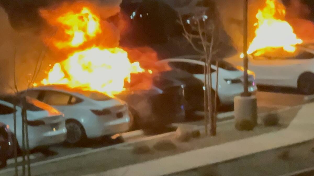 Several Tesla vehicles are seen engulfed in flames after Las Vegas police say they were set on ...