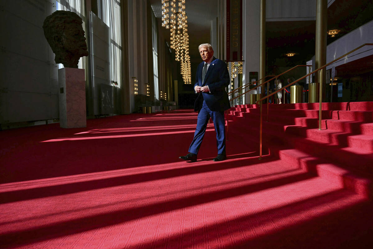 President Donald Trump walks as he tours the John F. Kennedy Center for the Performing Arts in ...