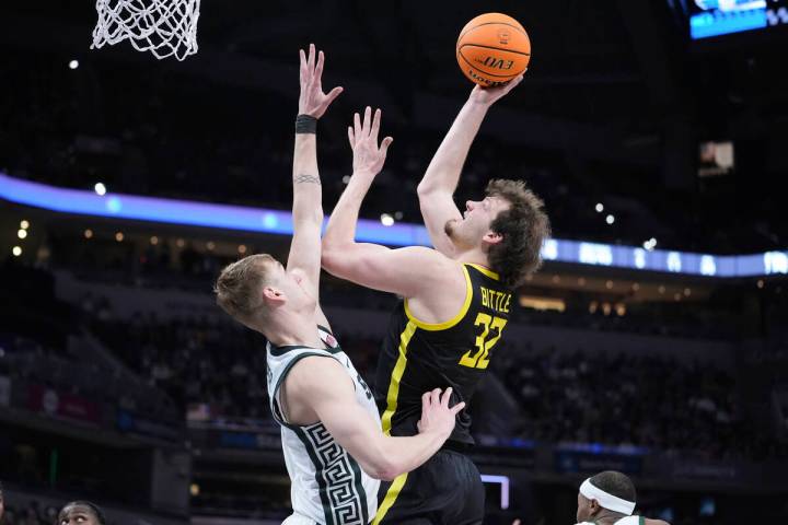 Oregon center Nate Bittle (32) shoots on Michigan State center Carson Cooper (15) during the se ...