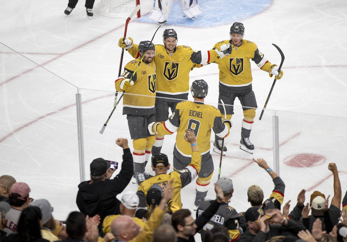 Vegas Golden Knights center Jack Eichel (9) celebrates his goal with his teammates during the N ...