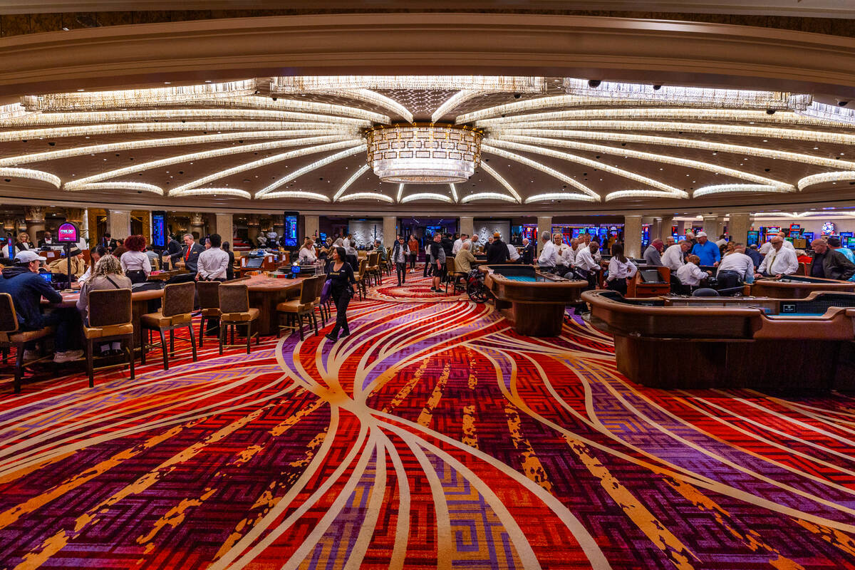 In this Review-Journal file photo, people play various games in the renovated casino dome table ...