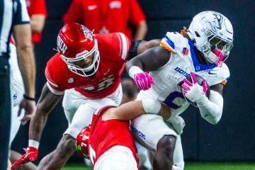 Boise State Broncos running back Ashton Jeanty (2) is turned back by UNLV linebacker Jackson Wo ...