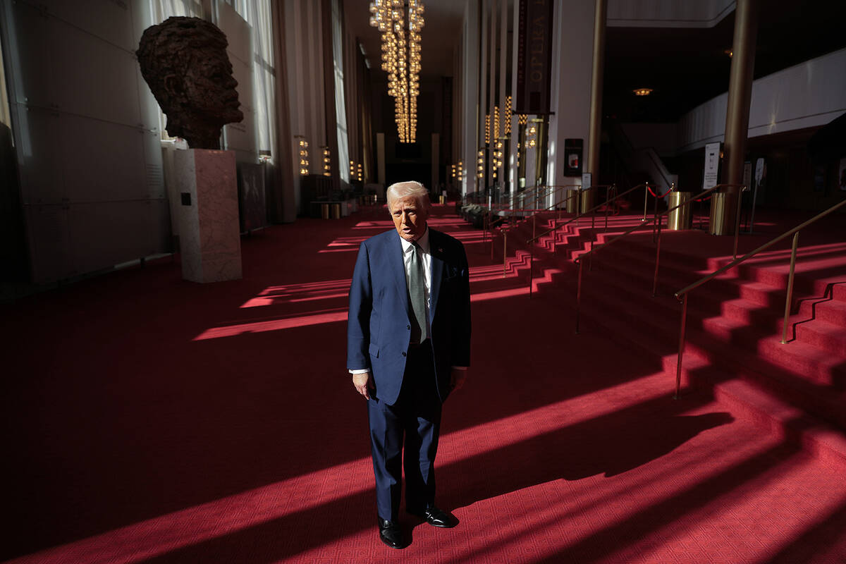 U.S. President Donald Trump talks to the media in the Hall of Nations during a tour at the John ...