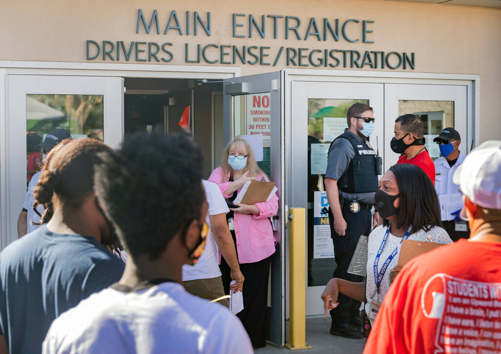Instructions are given to individuals without appointments at the Nevada Department of Motor Ve ...