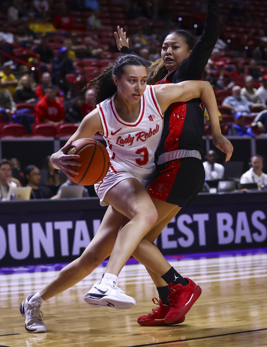 UNLV Lady Rebels guard Kiara Jackson (3) drives the ball against San Diego State Aztecs guard N ...