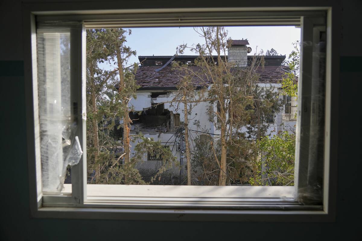 The impact of a projectile is visible on the wall of the U.N. guesthouse, where United Nations ...