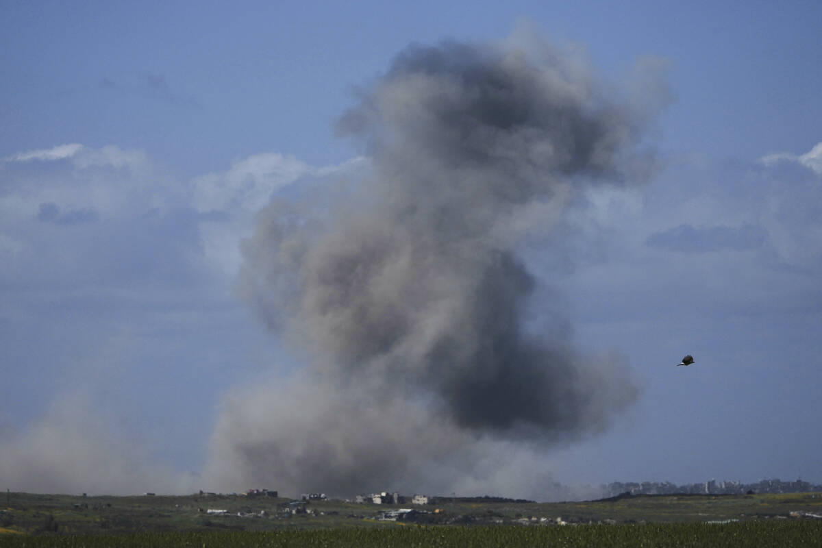 Smoke rises following an Israeli bombardment in the Gaza Strip, as seen from southern Israel, W ...