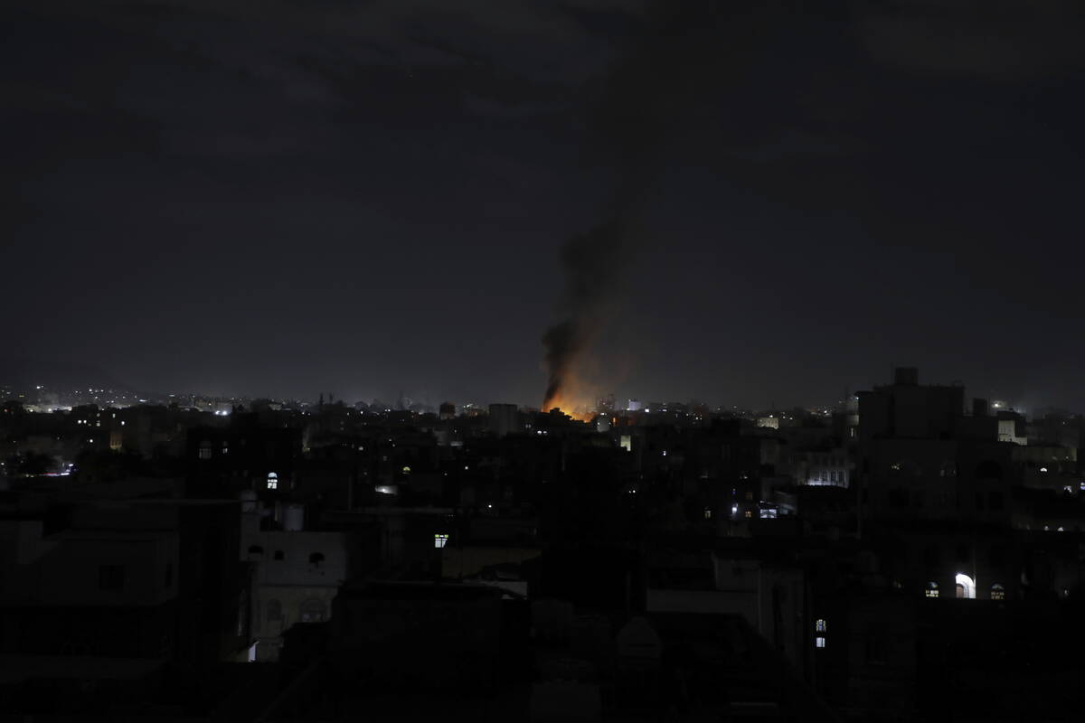 Smoke rises from a location reportedly struck by U.S. airstrikes in Sanaa, Yemen, Wednesday, Ma ...