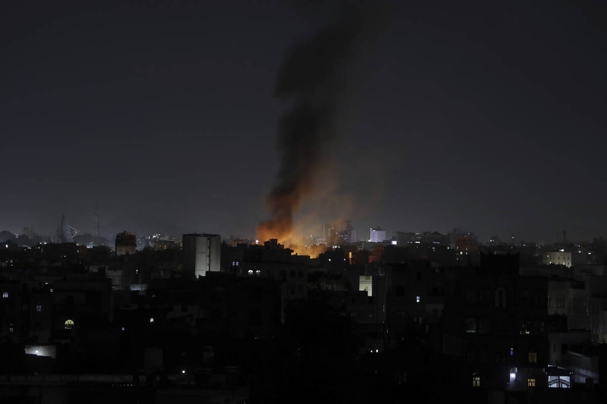 Smoke rises from a location reportedly struck by U.S. airstrikes in Sanaa, Yemen, Wednesday, Ma ...