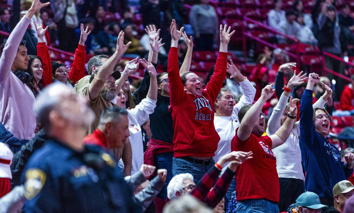 UNLV fans get excited in the stands against the Wyoming Cowboys during the second half of their ...