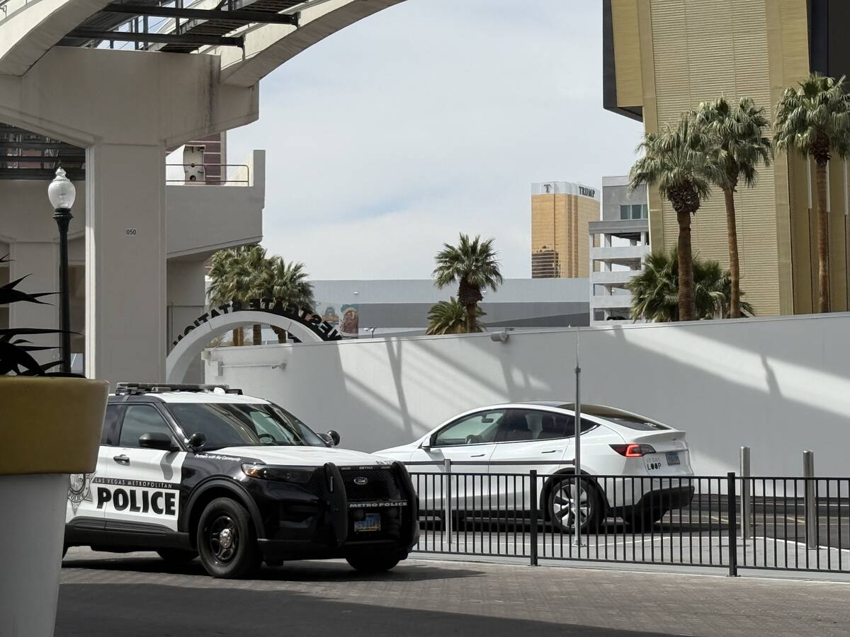 Metropolitan Police squad vehicle sits outside of Boring Company's Vegas Loop station at Westga ...