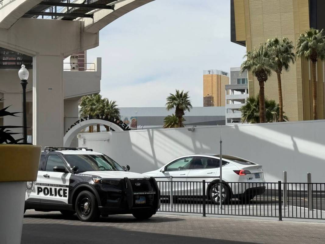 Metropolitan Police squad vehicle sits outside of Boring Company's Vegas Loop station at Westga ...