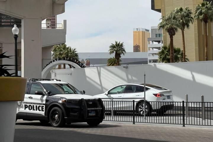 Metropolitan Police squad vehicle sits outside of Boring Company's Vegas Loop station at Westga ...