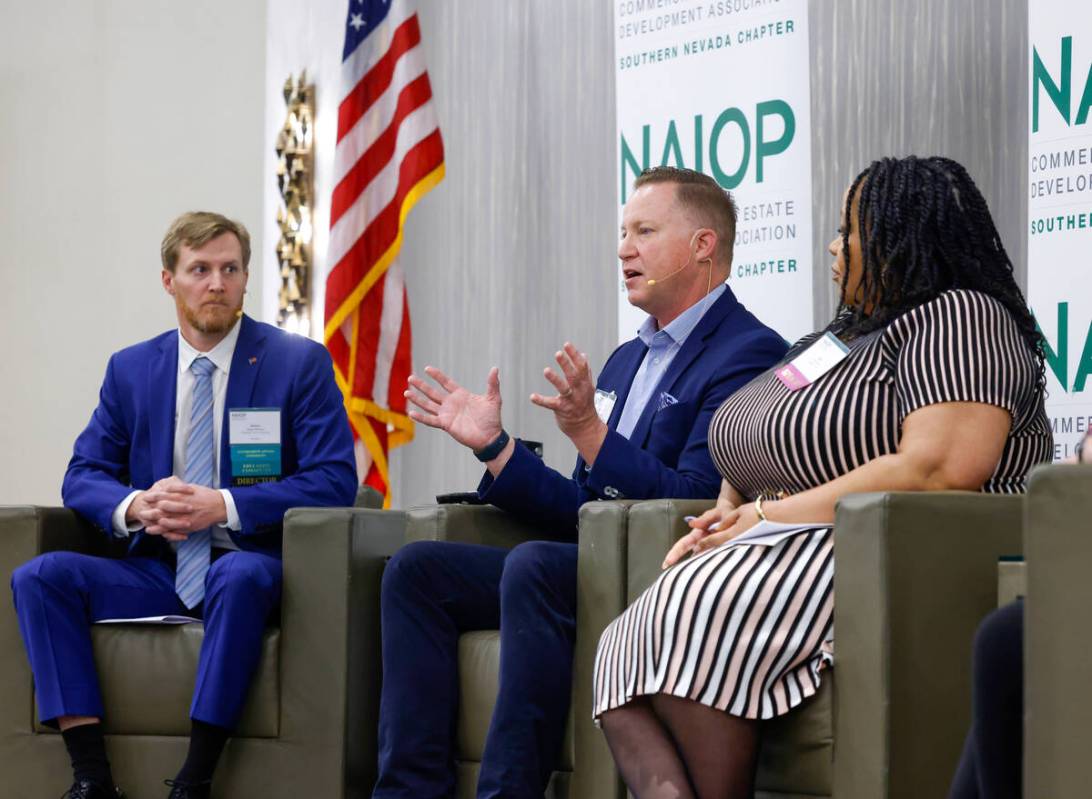 James Bristow, left, of Midnight Sun Consulting, a moderator, and Asha Jones, right, vice presi ...