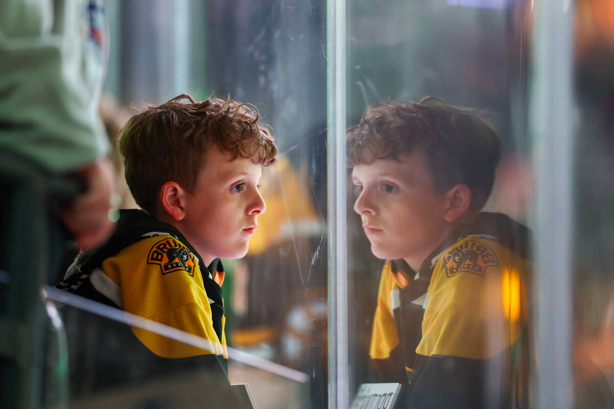 Boston Bruins fan Lucas Schena watches the ice before the Golden Knights play against the Bruin ...