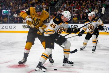 Golden Knights left wing Pavel Dorofeyev (16) and Boston Bruins left wing Cole Koepke (45) figh ...