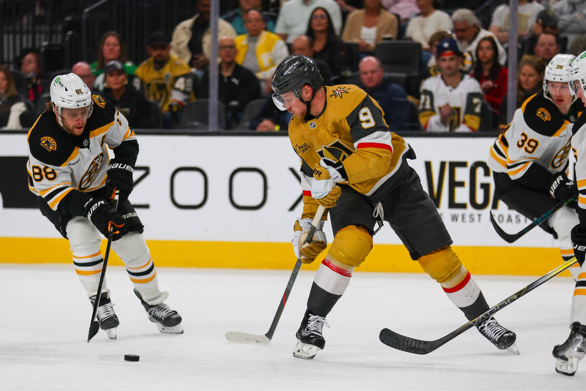 Golden Knights center Jack Eichel (9) skates against Boston Bruins right wing David Pastrnak (8 ...
