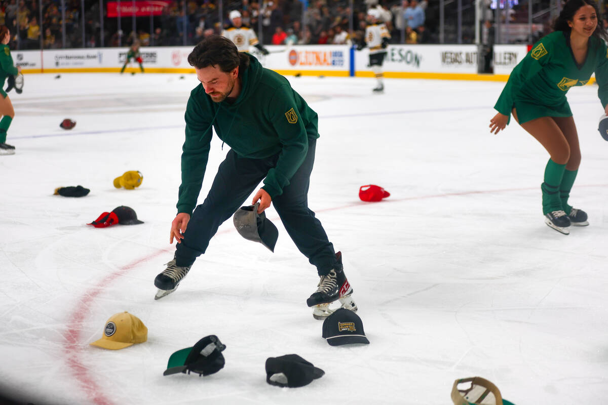 Hats are collected from the rink after Golden Knights left wing Pavel Dorofeyev (16) scored a h ...