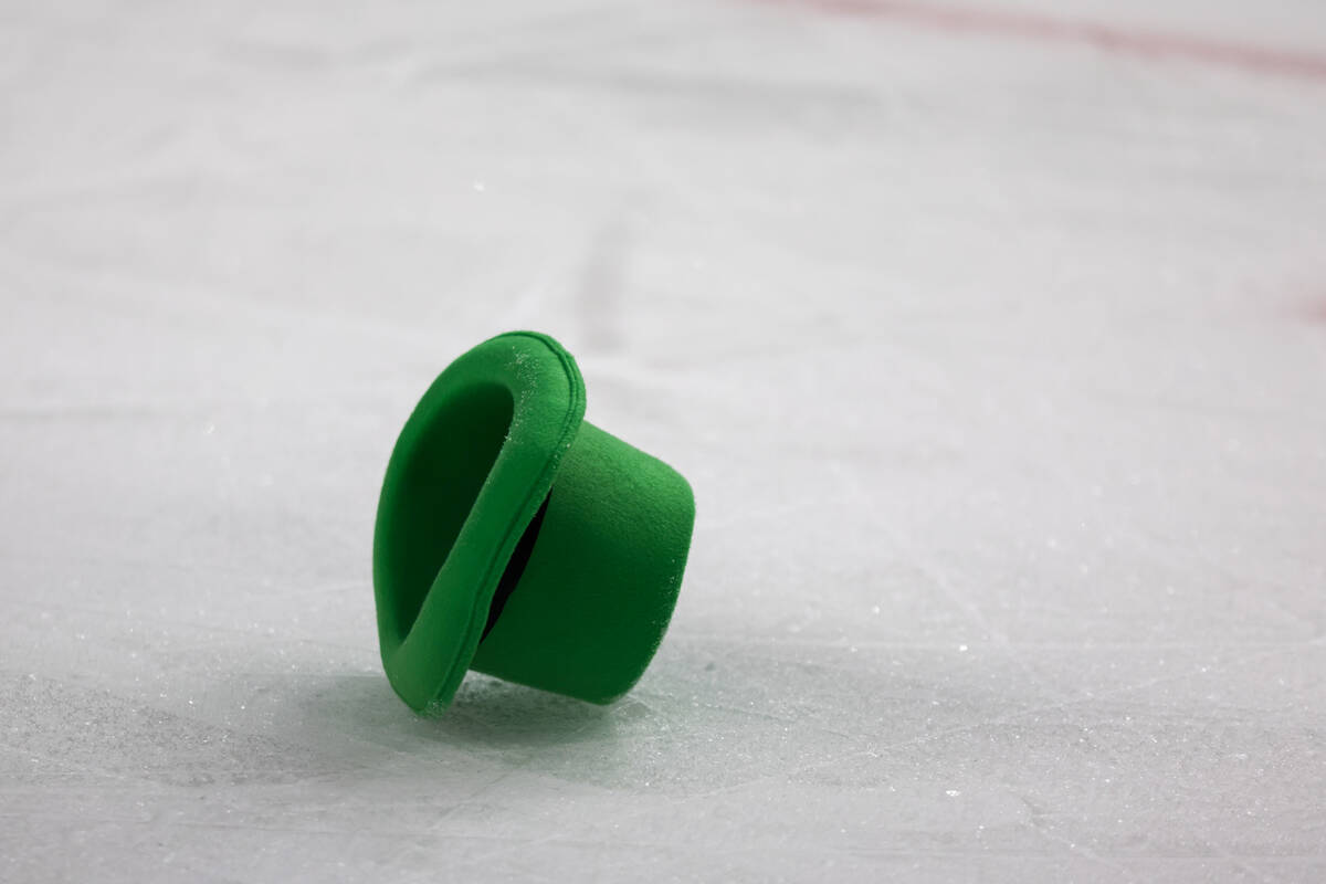 A green St. Patrick’s Day-themed hat lies on the rink after Golden Knights left wing Pav ...