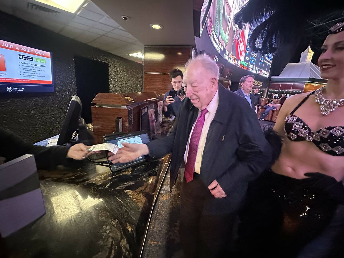 Former Las Vegas Mayor Oscar Goodman makes his March Madness wager at Westgate SuperBook on Wed ...
